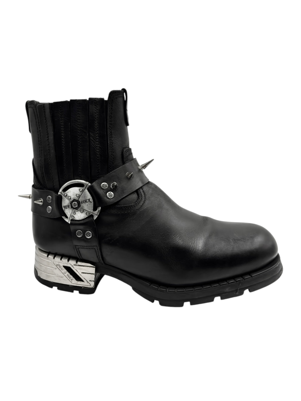 Black ankle biker boots with metal-studded strap across the upper