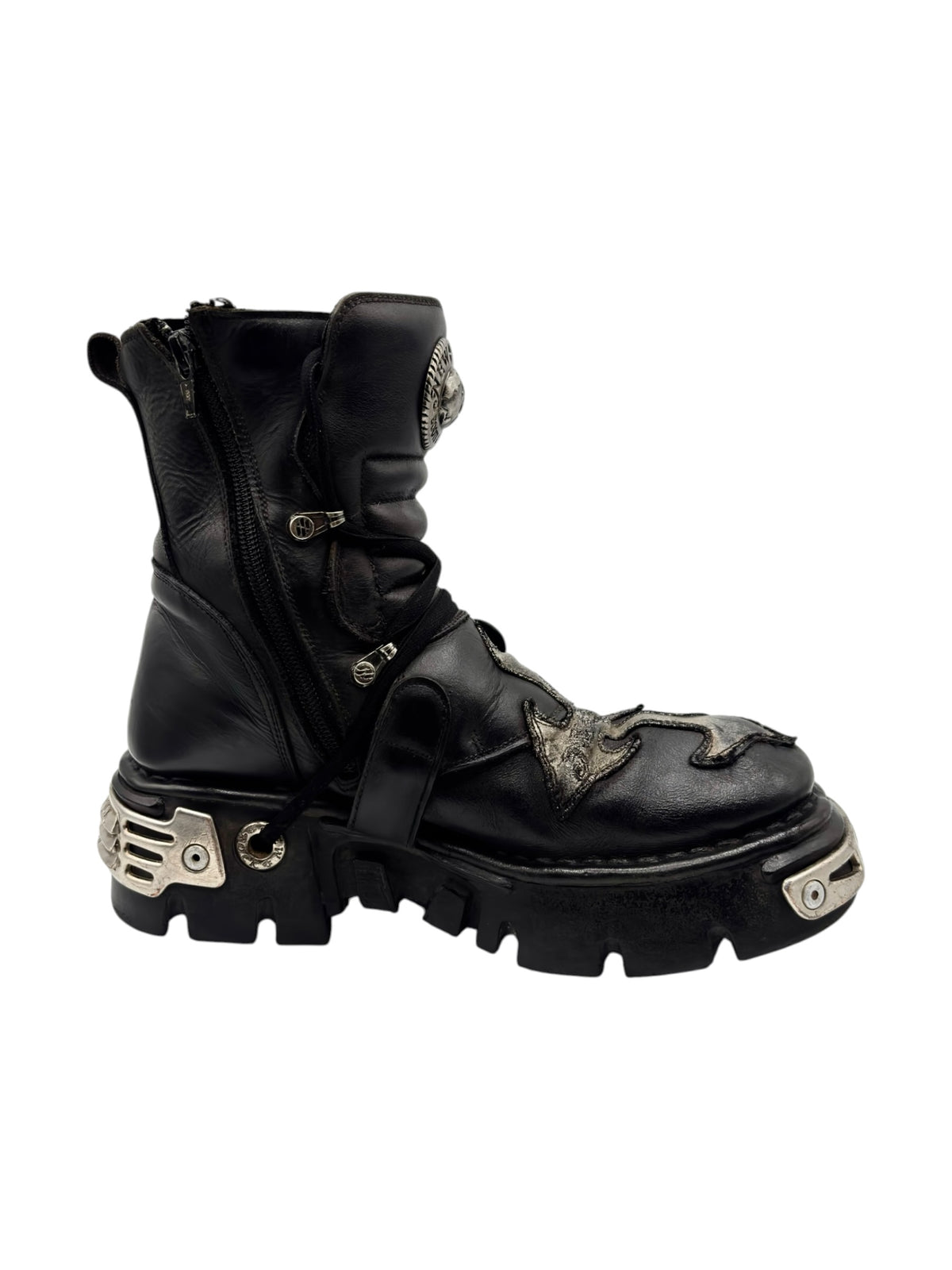 Black lace-up boots with side straps, buckles, and silver-toned sole details