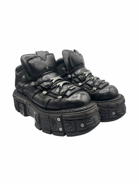 Black platform boots side-by-side angle showing laces and rugged outsole tread