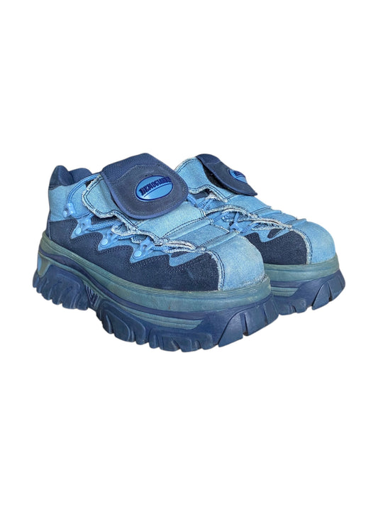 Blue platform boots with hook-and-loop strap and lace-up front detail