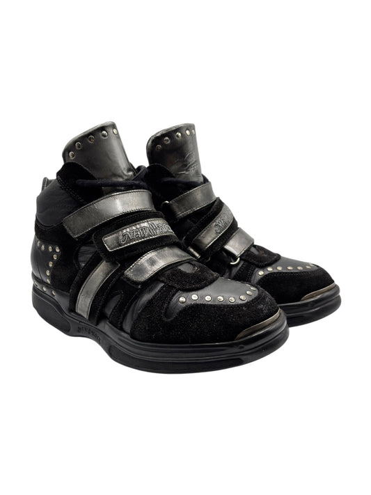 Black leather strap sneakers with silver buckle and metal studs, chunky sole