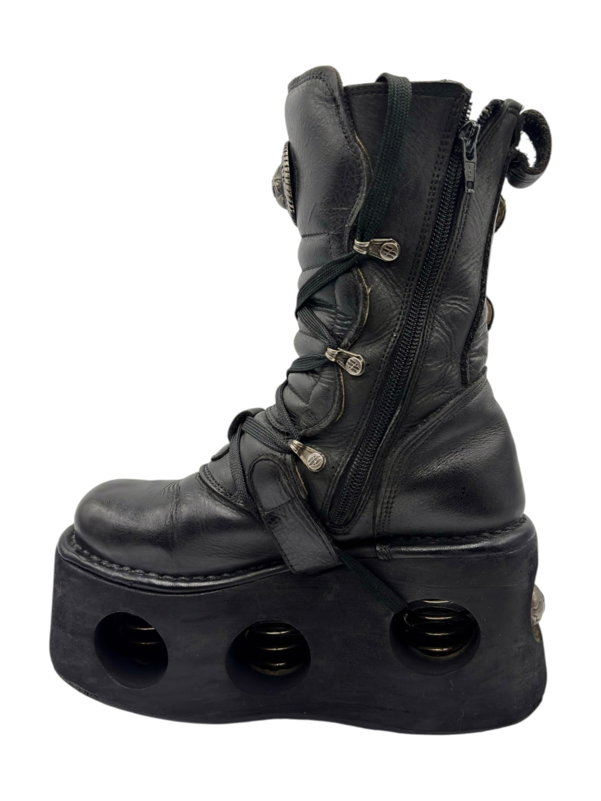 Black mid-calf platform boots with lace-up closure and front buckle straps