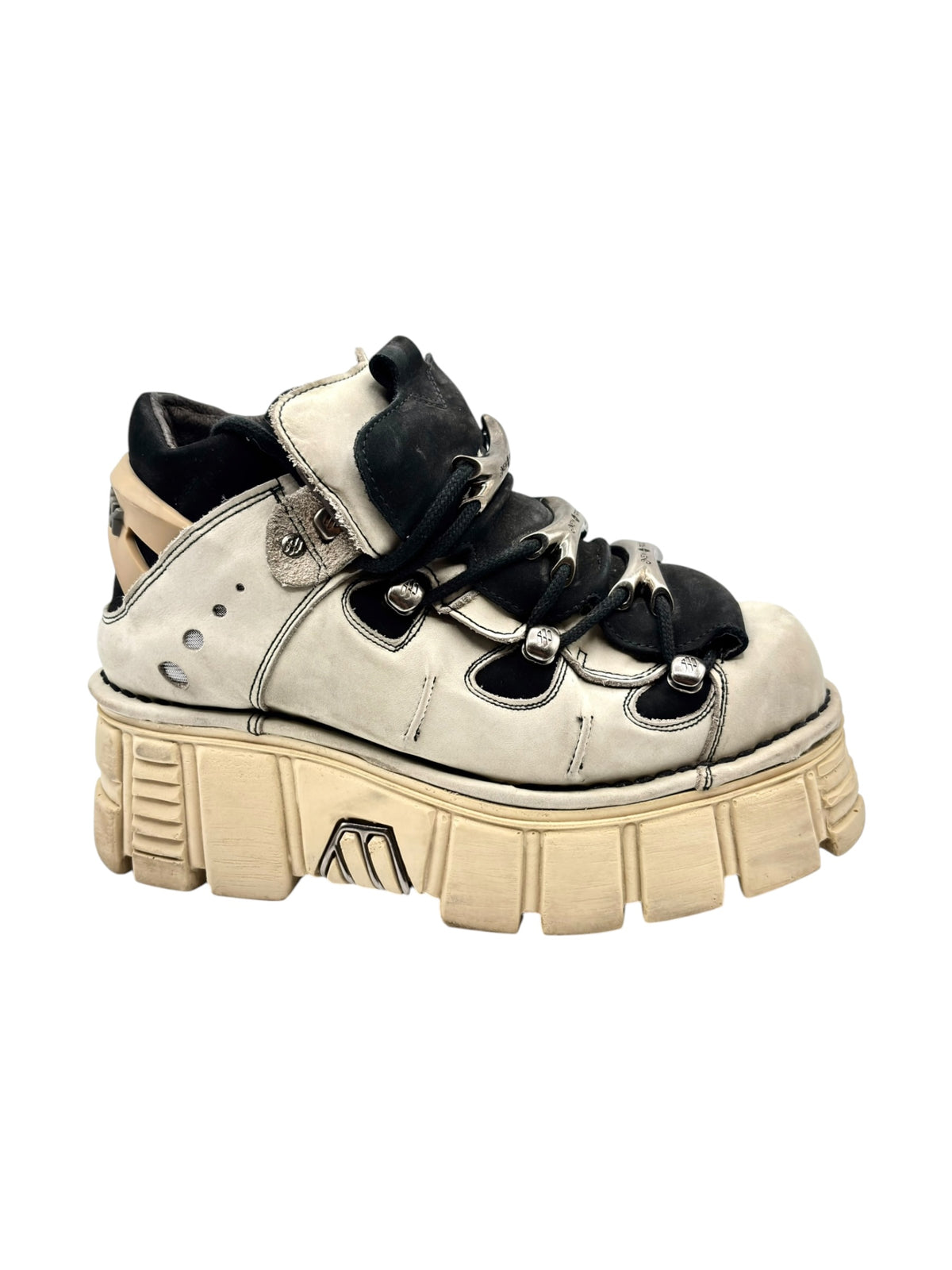 Beige leather platform boot with black side panels, lace-up closure, and tan sole