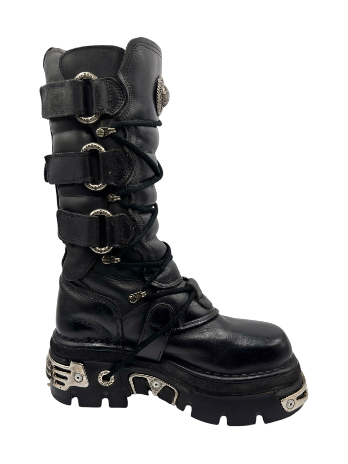 Black knee-high leather boots with stacked buckle straps and rugged lug sole
