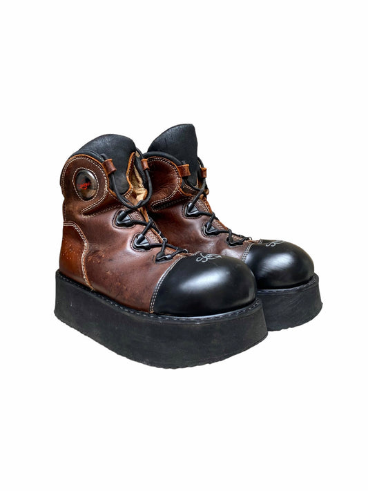 Brown and black platform lace-up truck boots with thick black sole