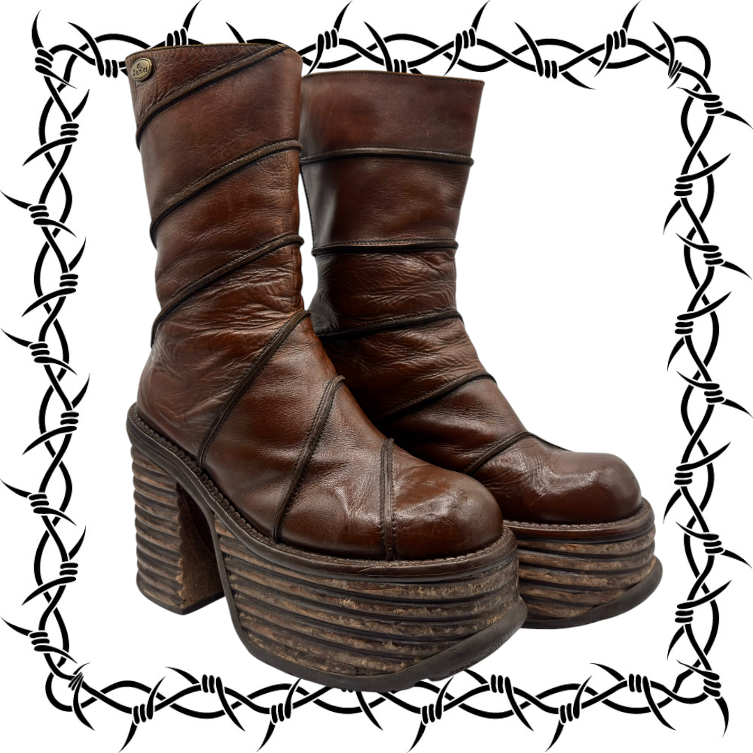 Brown mid-calf platform block boots with stacked heel and side seam stitching.