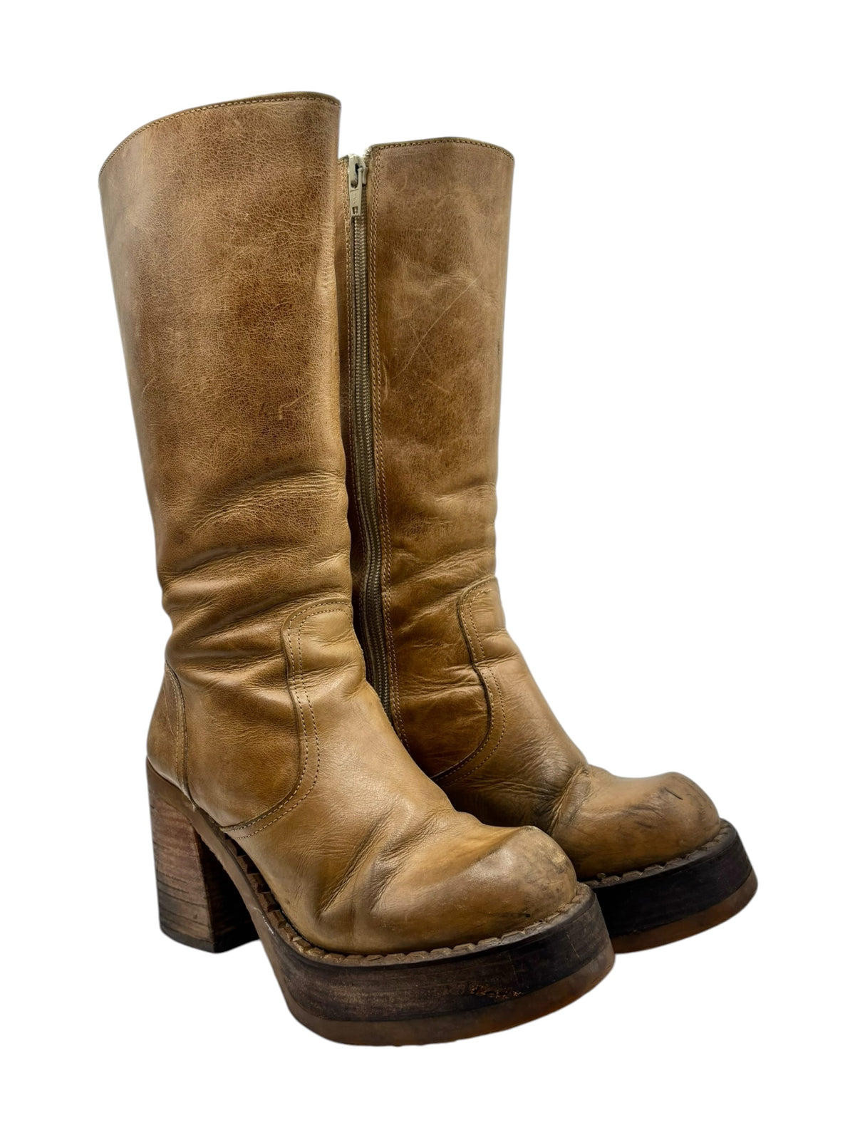 Tan knee-high block heel boots, side angle, side zipper and distressed leather finish.