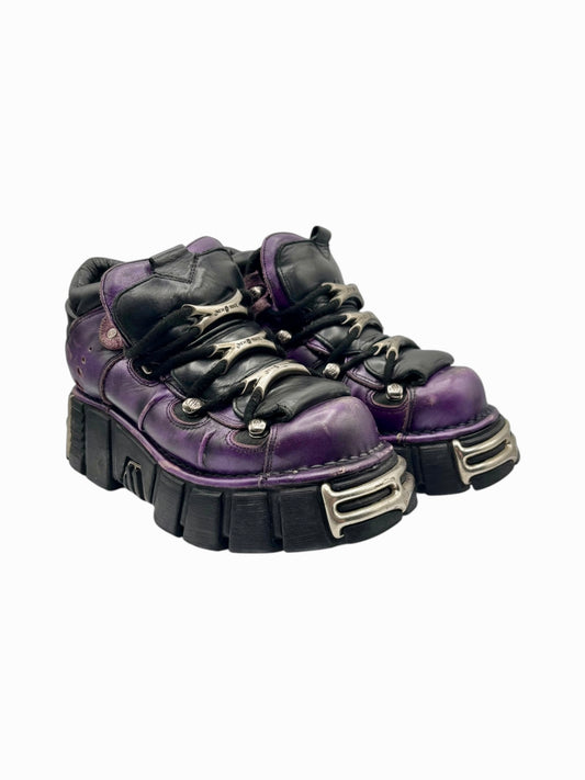 Purple and black lace-up platform boots with chunky sole and shiny metal lace hardware