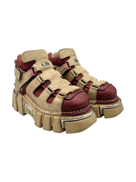 Beige and red vintage platform boots with buckled straps, chunky tread soles