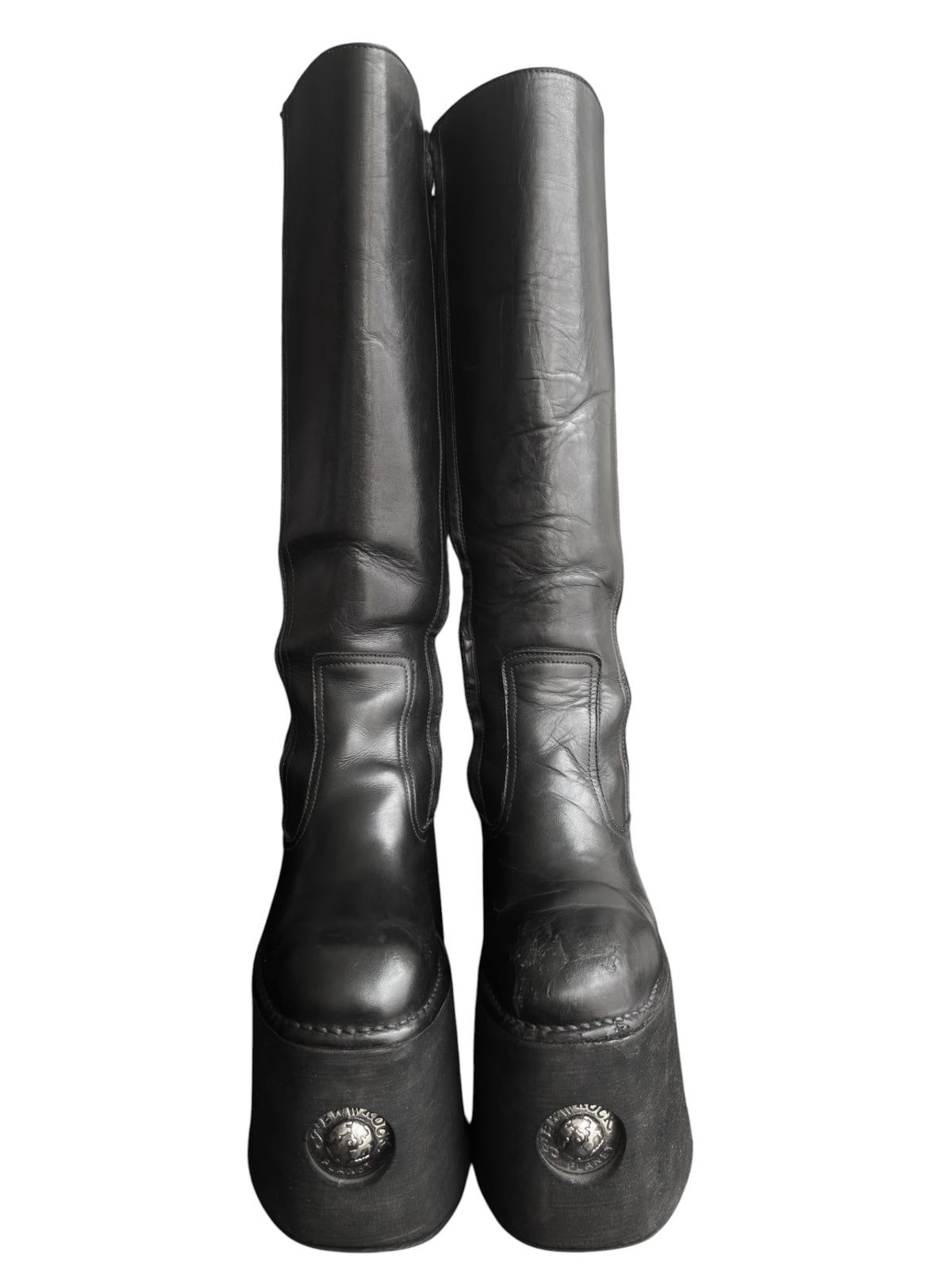 Knee-high platform boots, rear view showing tall shaft and heel logos