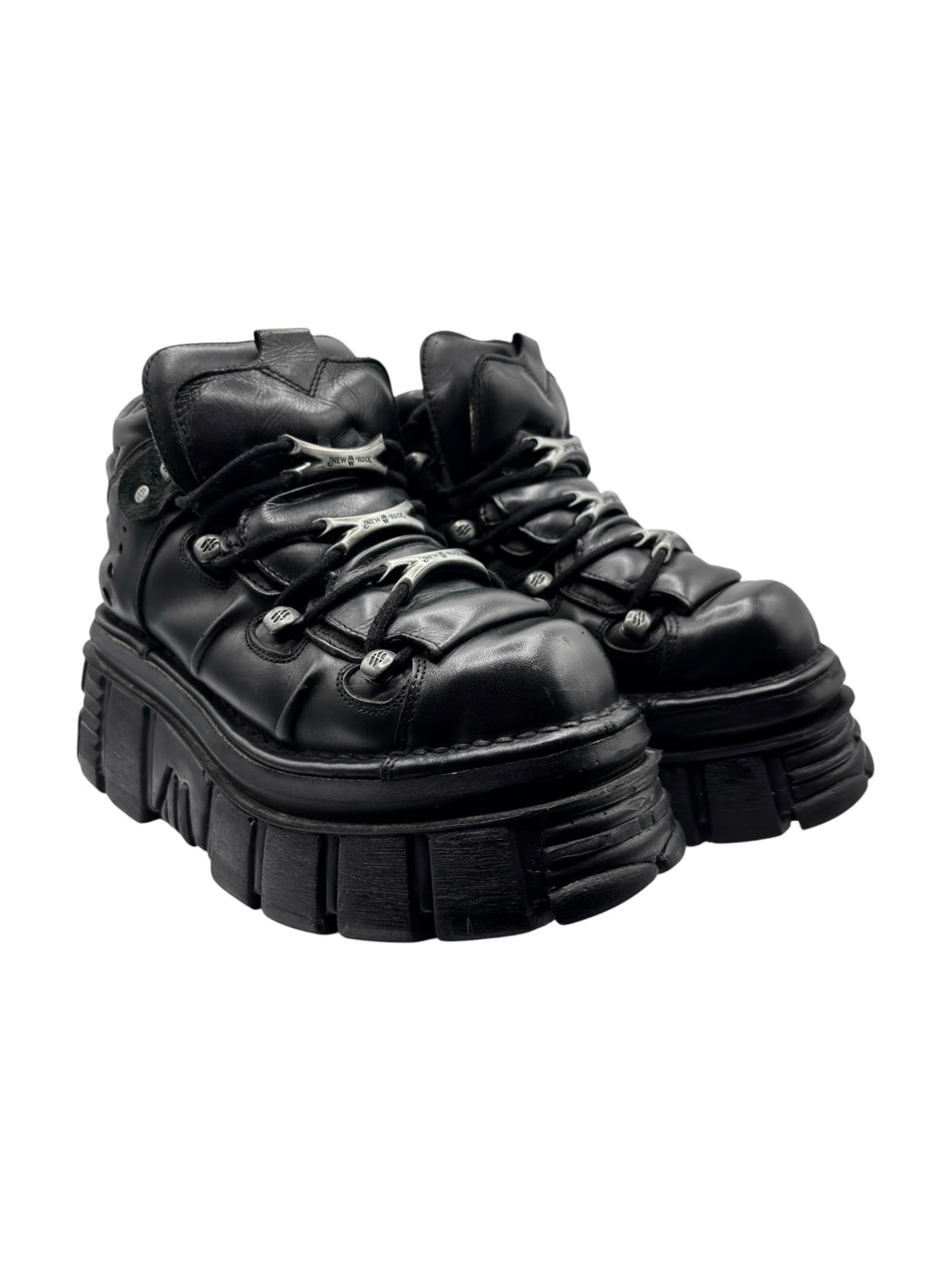Black lace-up platform boots angled side view with quilted-look upper and chunky tread