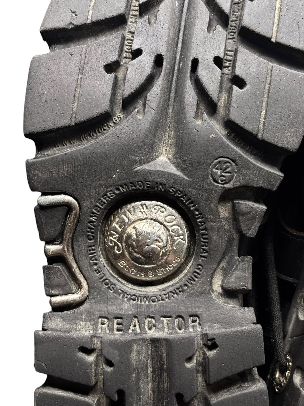 Reactor platform boot sole detail with studded tread and “REACTOR” text.