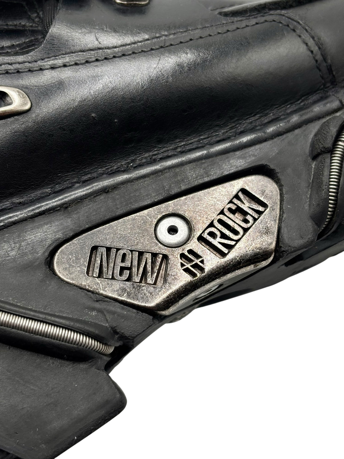 New Rock vintage boot side logo plate with NEW ROCK lettering on black leather