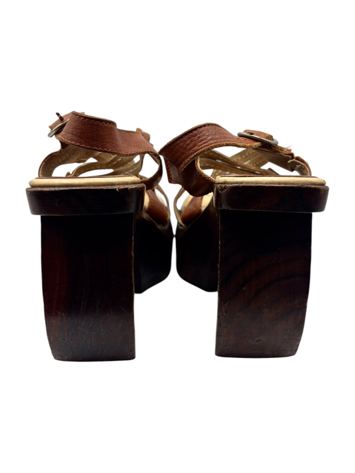 Brown leather platform sandal heels viewed from behind with open toe straps