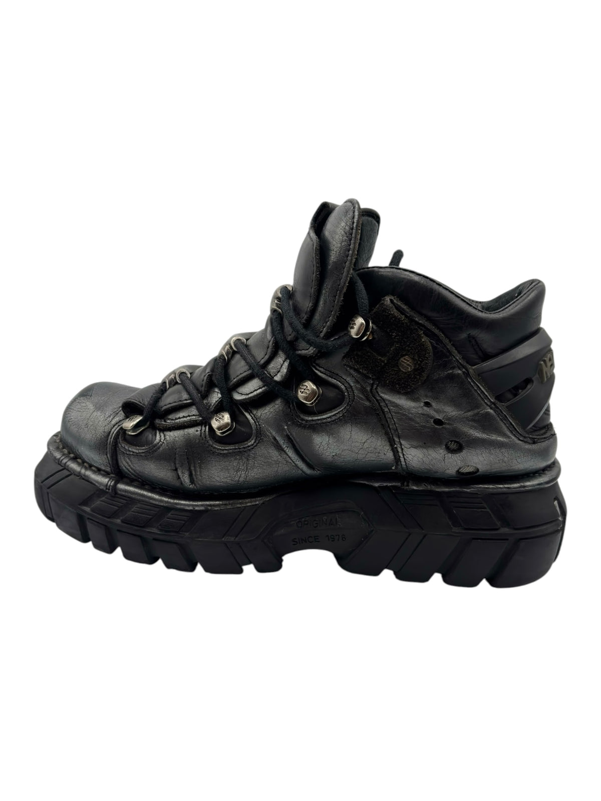 Black lace-up platform trailer boots with chunky tread and padded collar