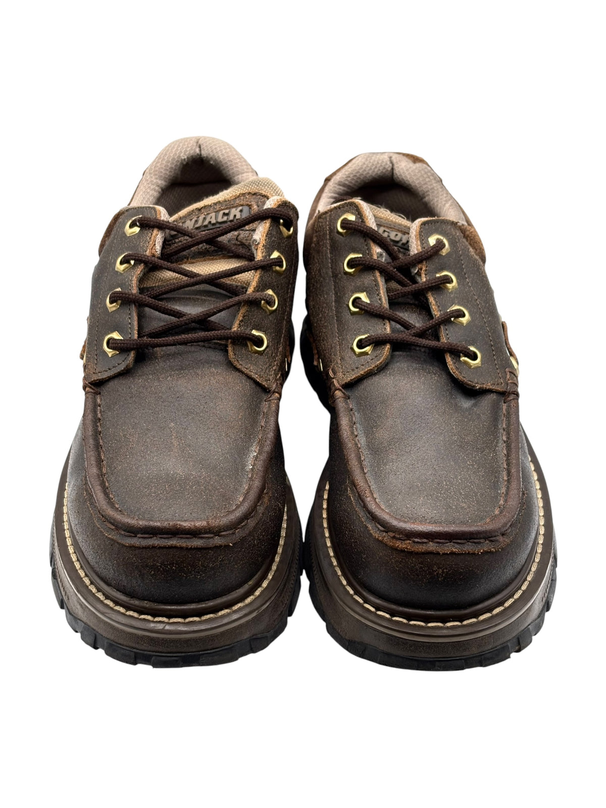 Front view of brown leather lace-up platform boots with worn toe finish