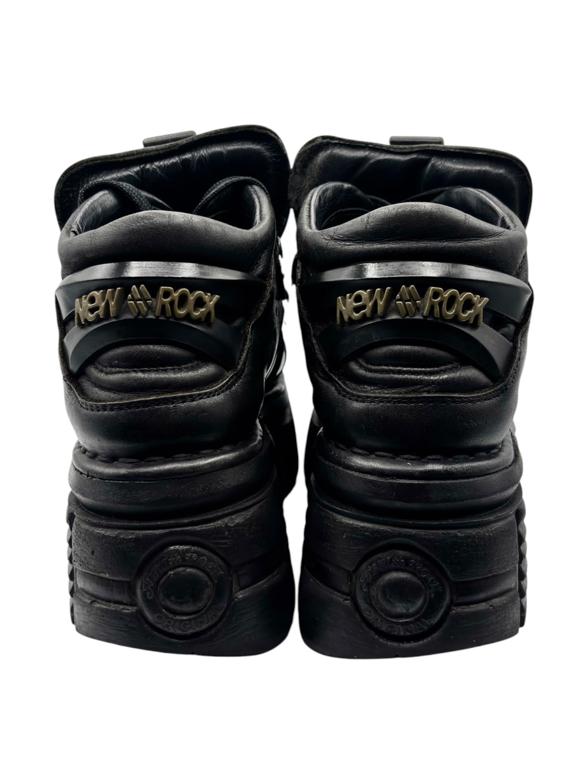 Black platform boots back view with brand heel patch and padded collar