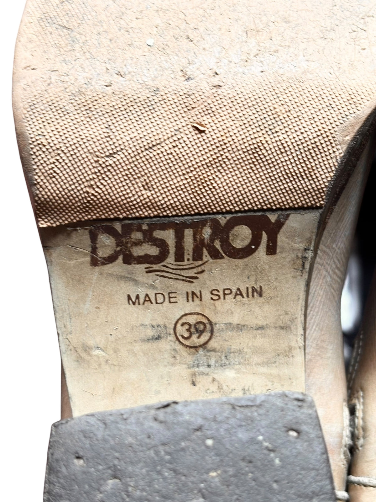 Beige knee-high leather boots insole label with DESTROY text and size 39 mark.