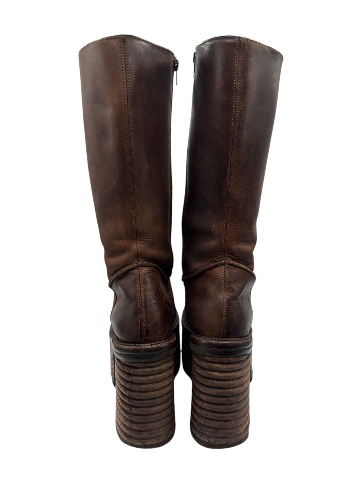 Back view of dark brown knee-high platform boots with stacked heels and zipper