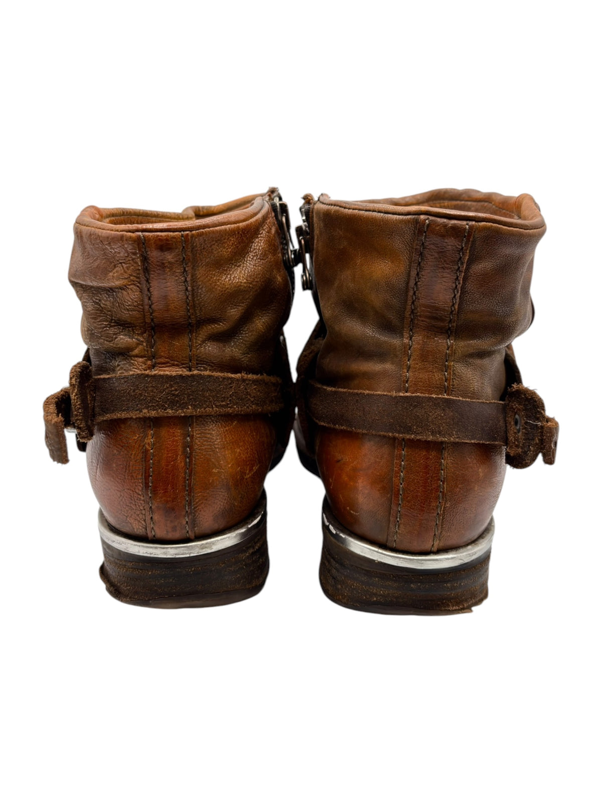 Brown leather ankle boots, heel view with vertical seams and back pull tab
