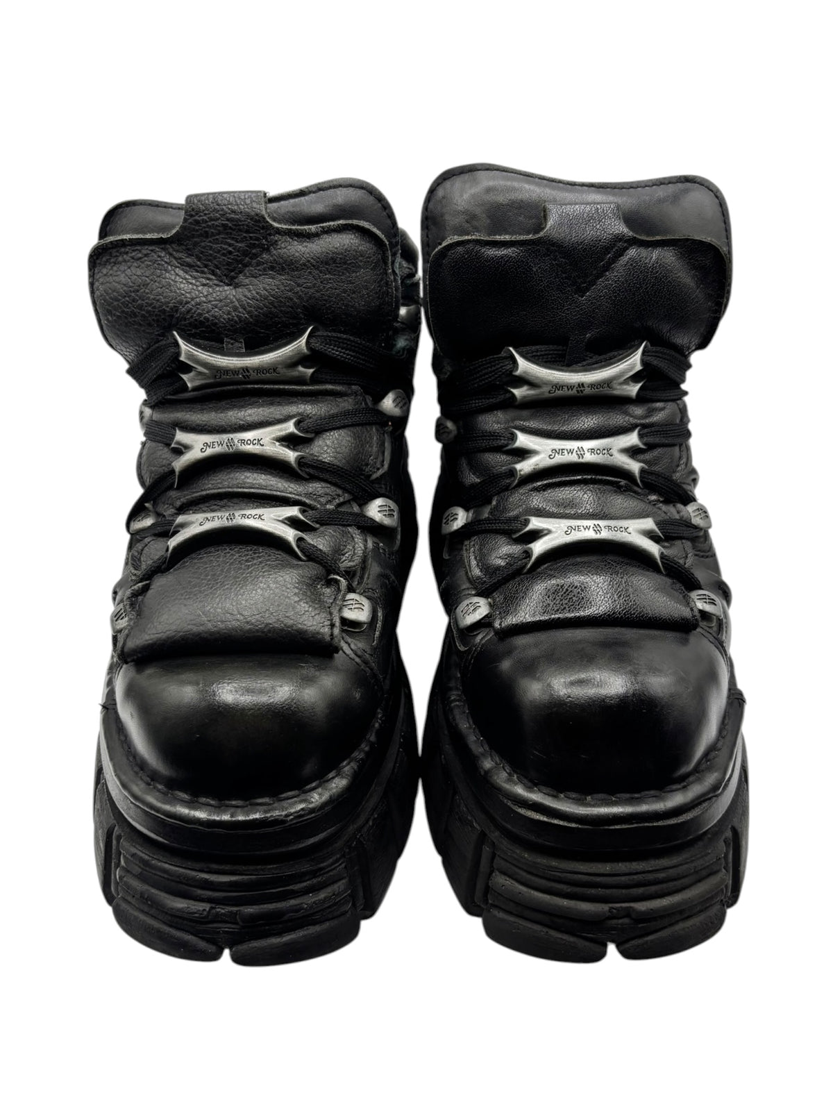Black platform boots with laces, rounded toe, and stacked sole layers.