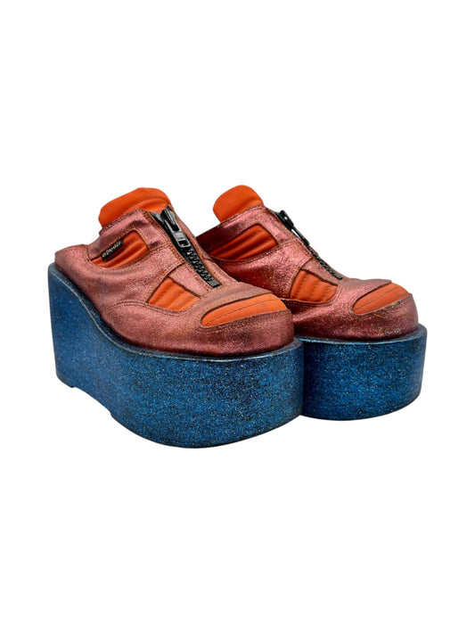 Vintage platform clogs in rust orange and brown with blue foam soles