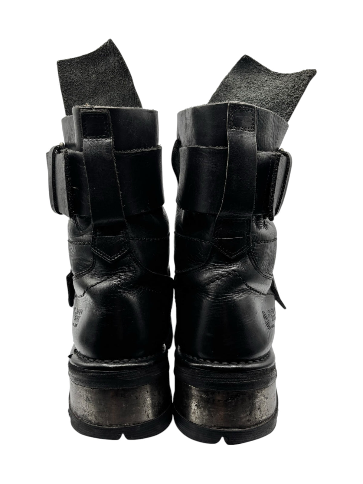 Black leather lace-free boots with rear cutouts and reinforced sole