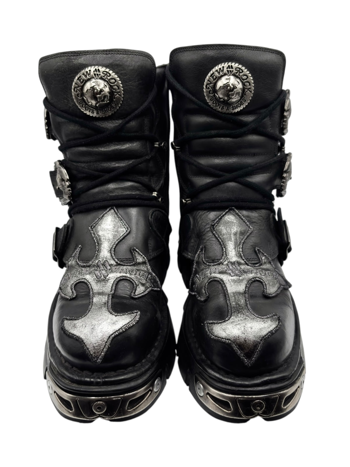 Black platform boots with silver flame-like accents, lace-up, side buckles and studs