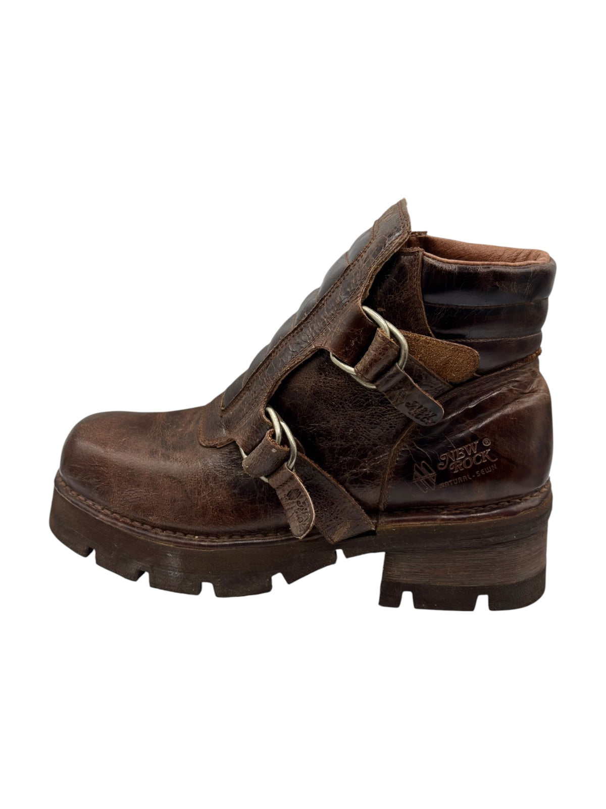 Brown leather ankle boot with side strap buckle and thick rubber sole