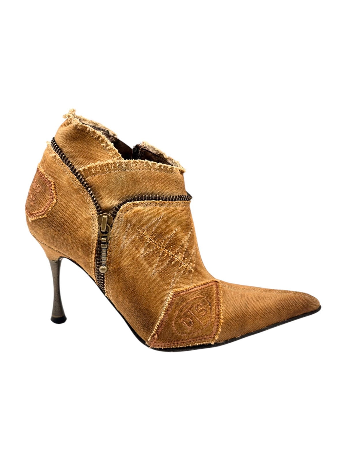 Tan ankle boots with high heels, asymmetrical upper patch and visible zipper
