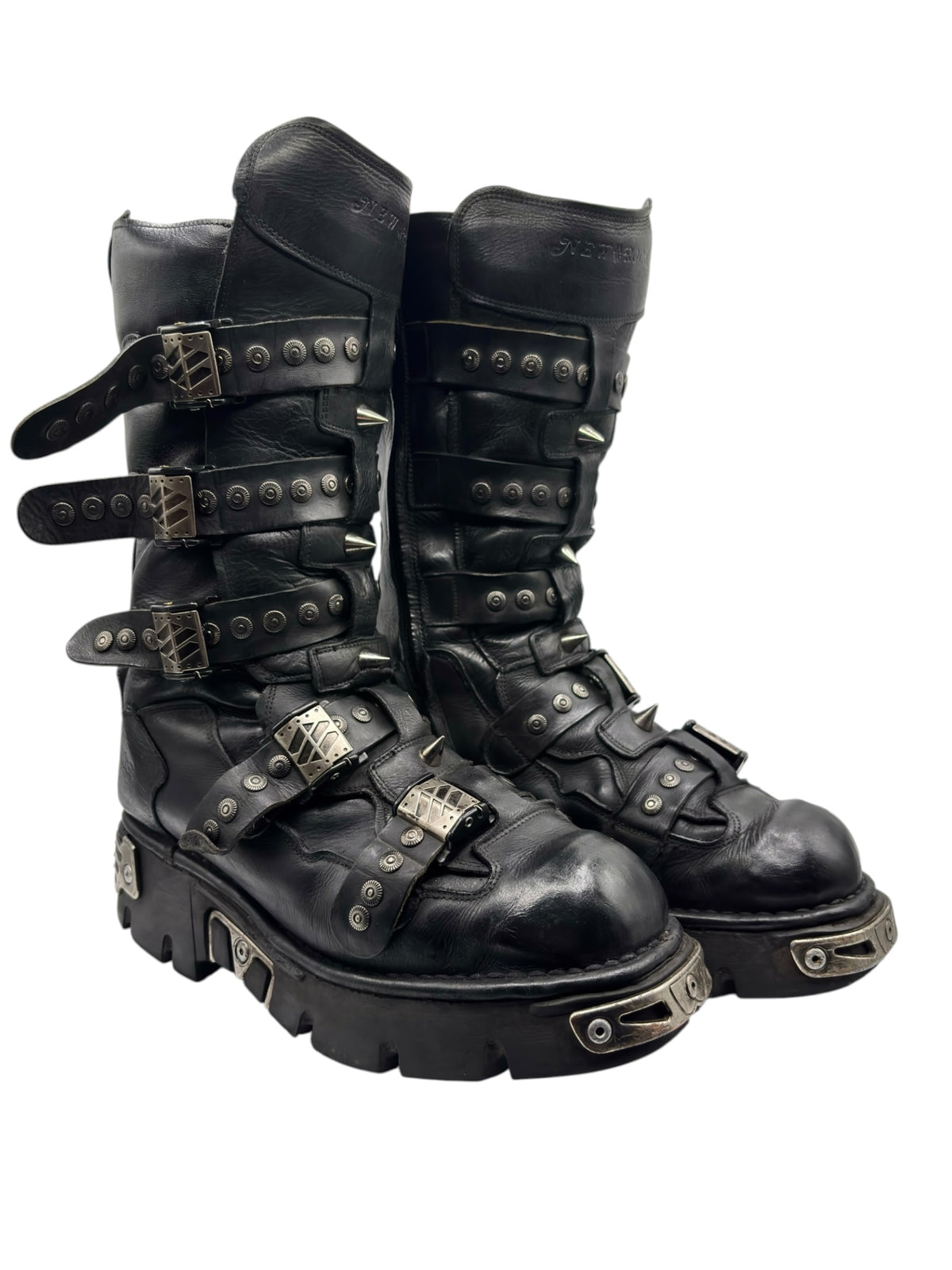 Black studded leather platform boots, side view with buckles and strap details