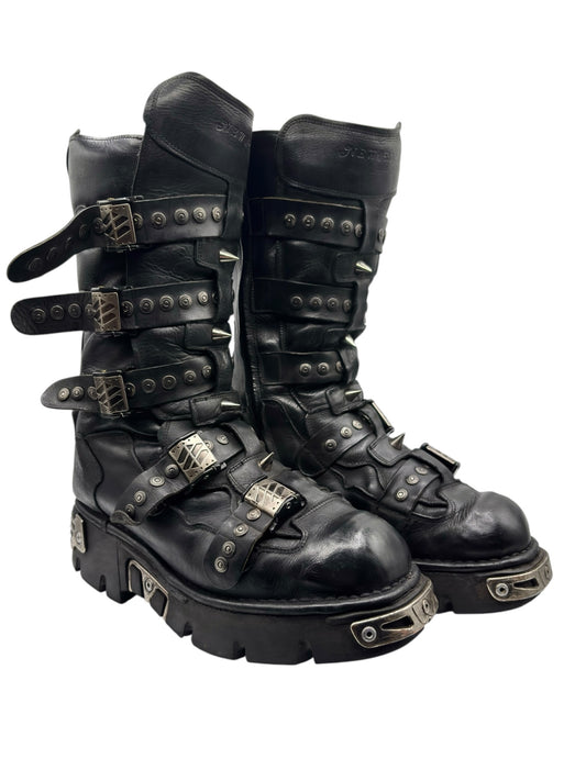 Black studded leather platform boots, side view with buckles and strap details