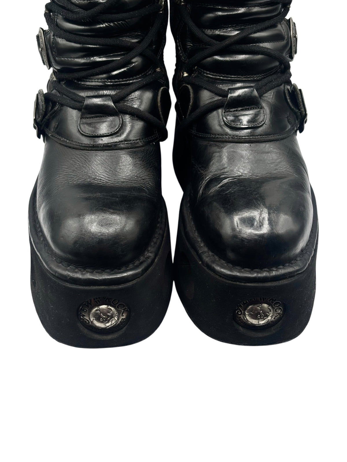 Black mid-calf platform boots with lace-up top and metal toe cap