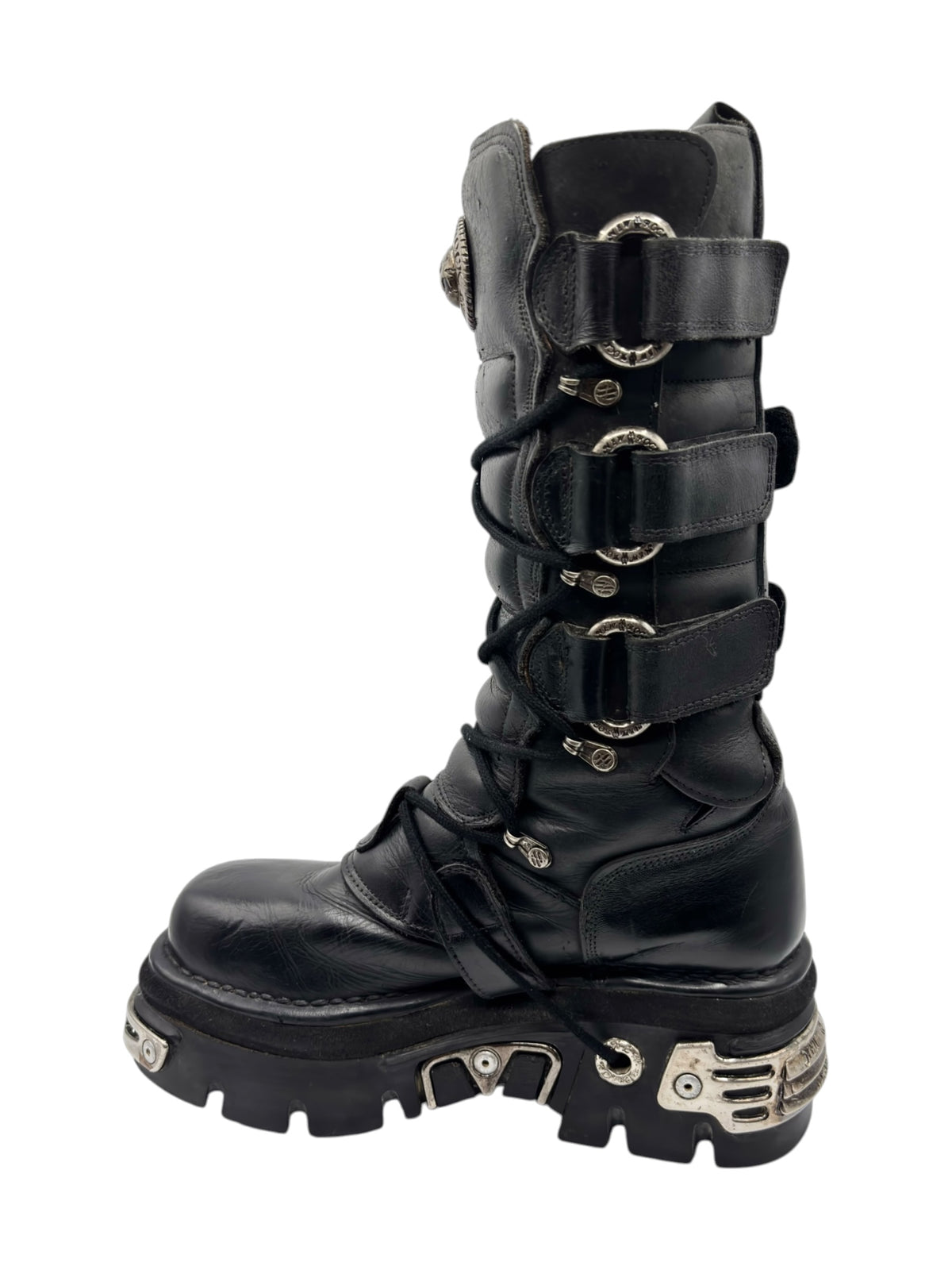 Black knee-high leather boots with multiple buckle straps and thick tread sole