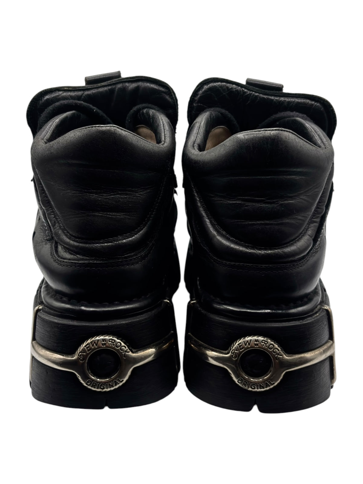 Black platform boot heels with gold-toned heel logo and padded collar