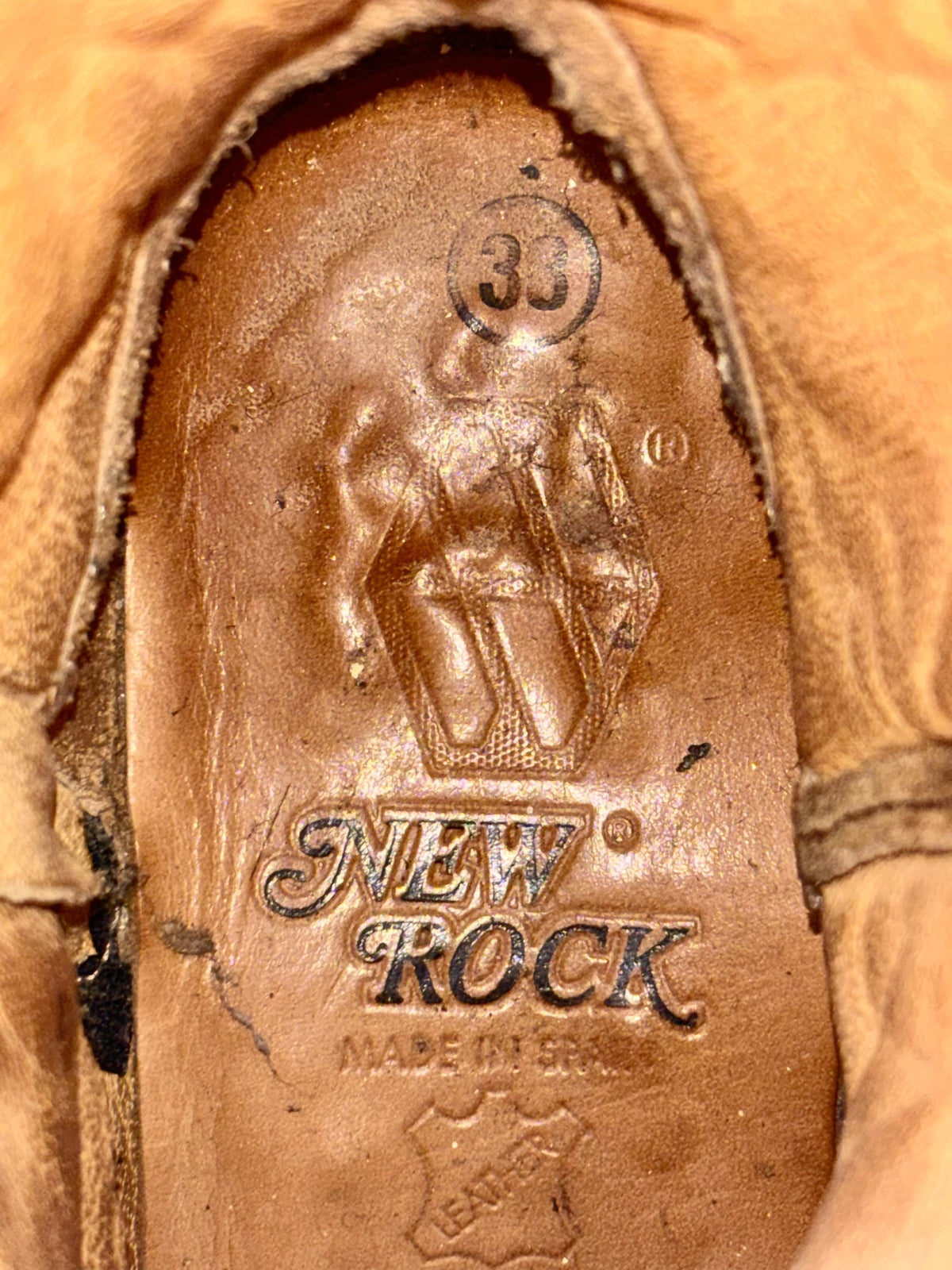 Inside heel label on brown New Rock cowboy boot, reading "NEW ROCK"