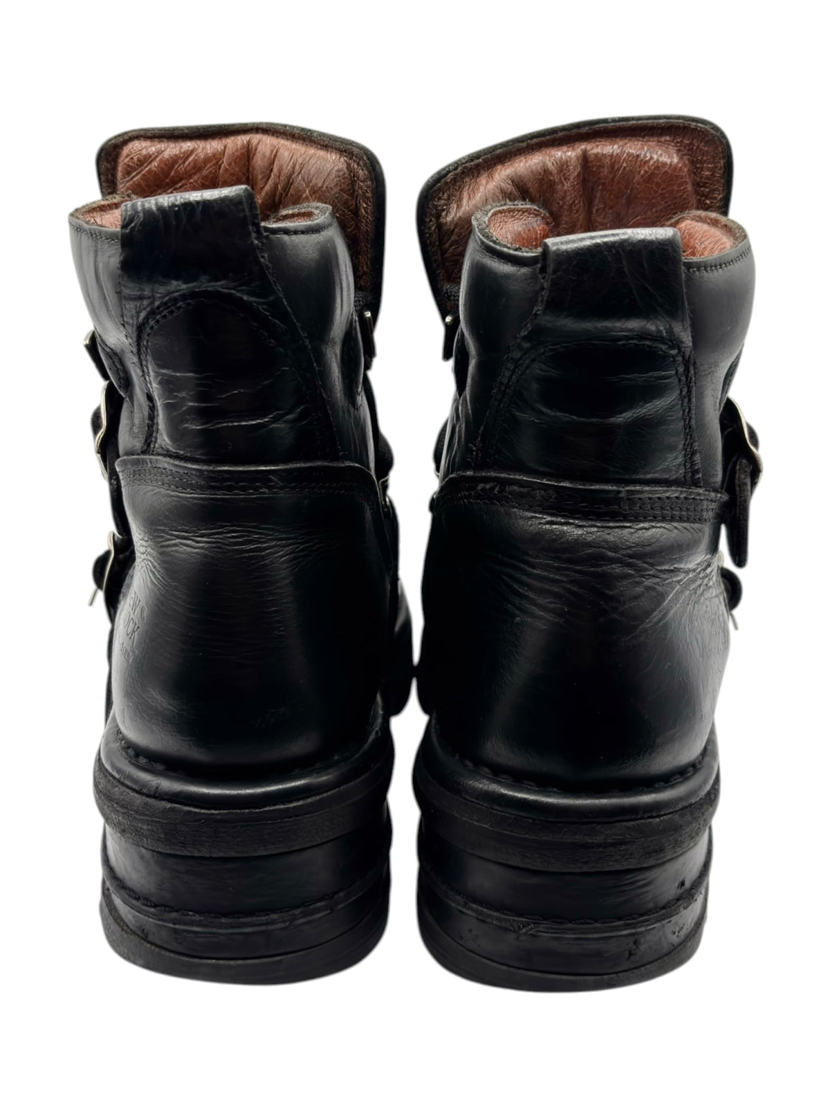 Vintage raised-heel leather boots back view showing heel and ankle opening