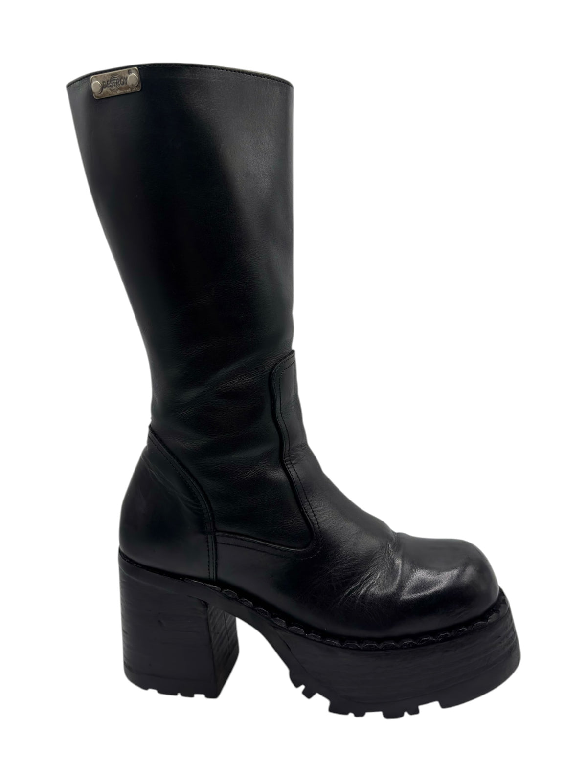 Black knee-high platform boots with stacked heel and quilted leather panels