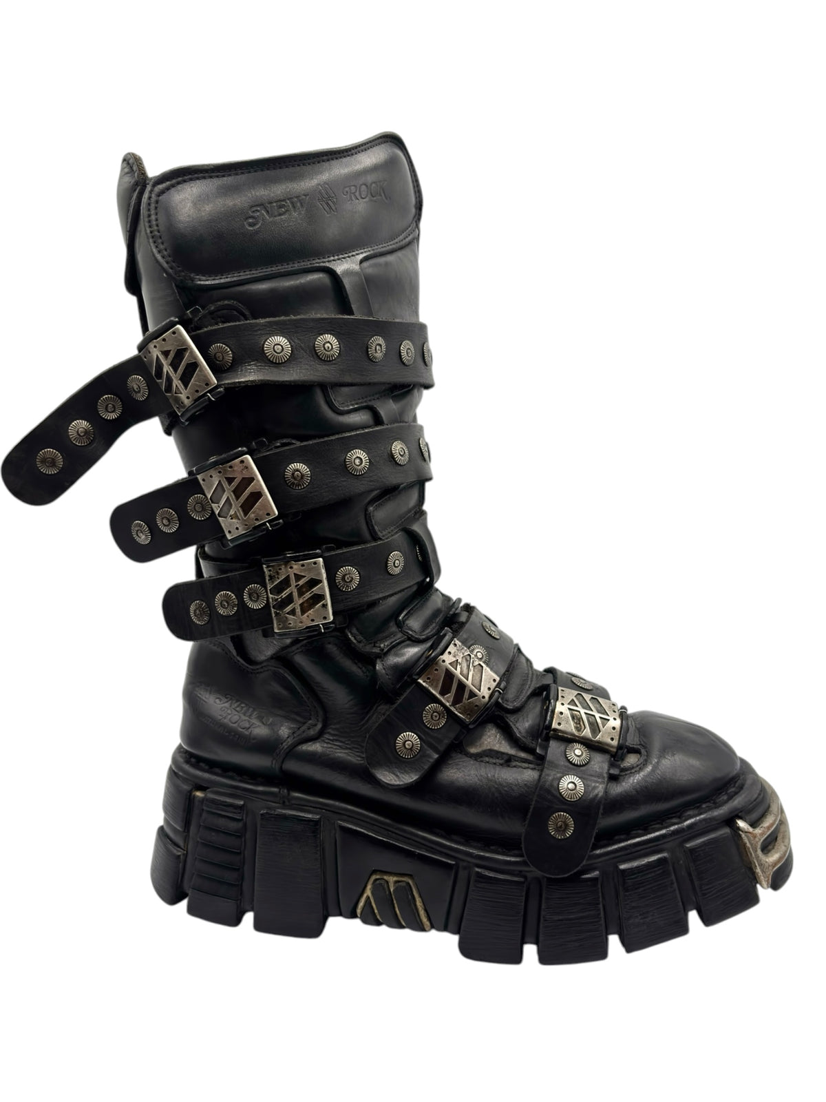 Black studded strap boot with metal buckles, side strap, and thick tread platform