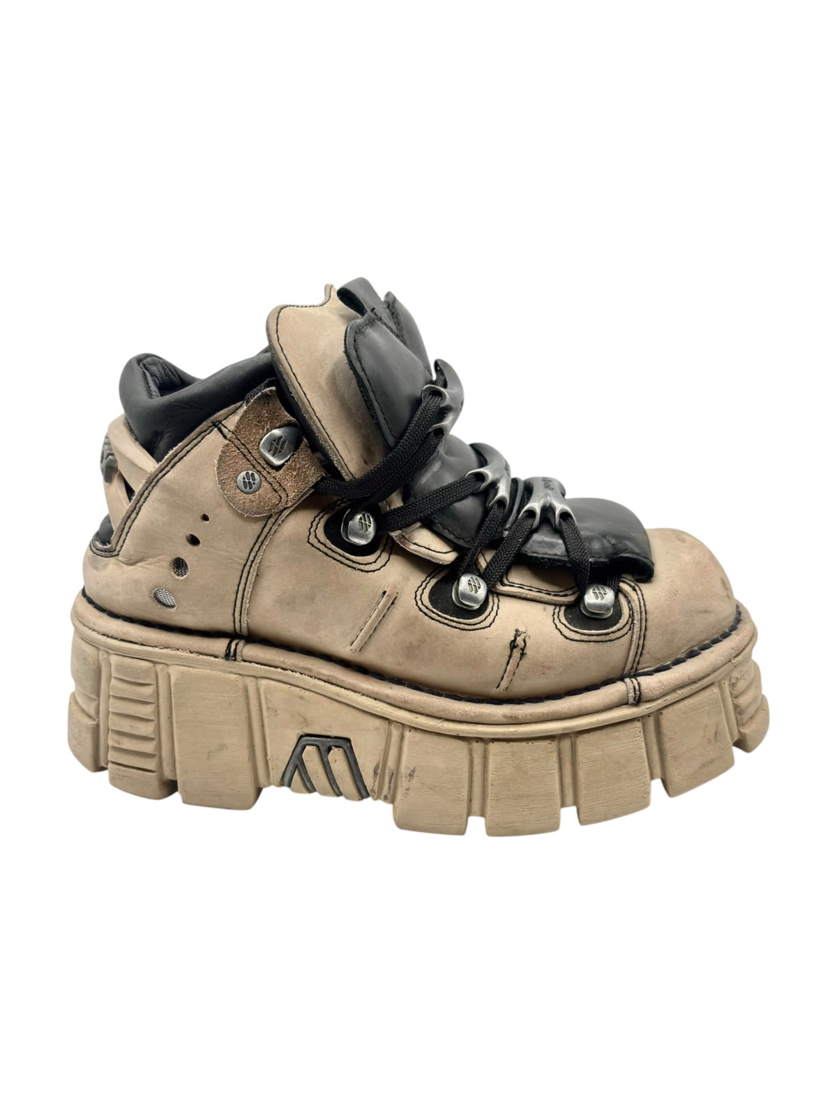 Beige and black platform boots side view with chunky outsole and laces