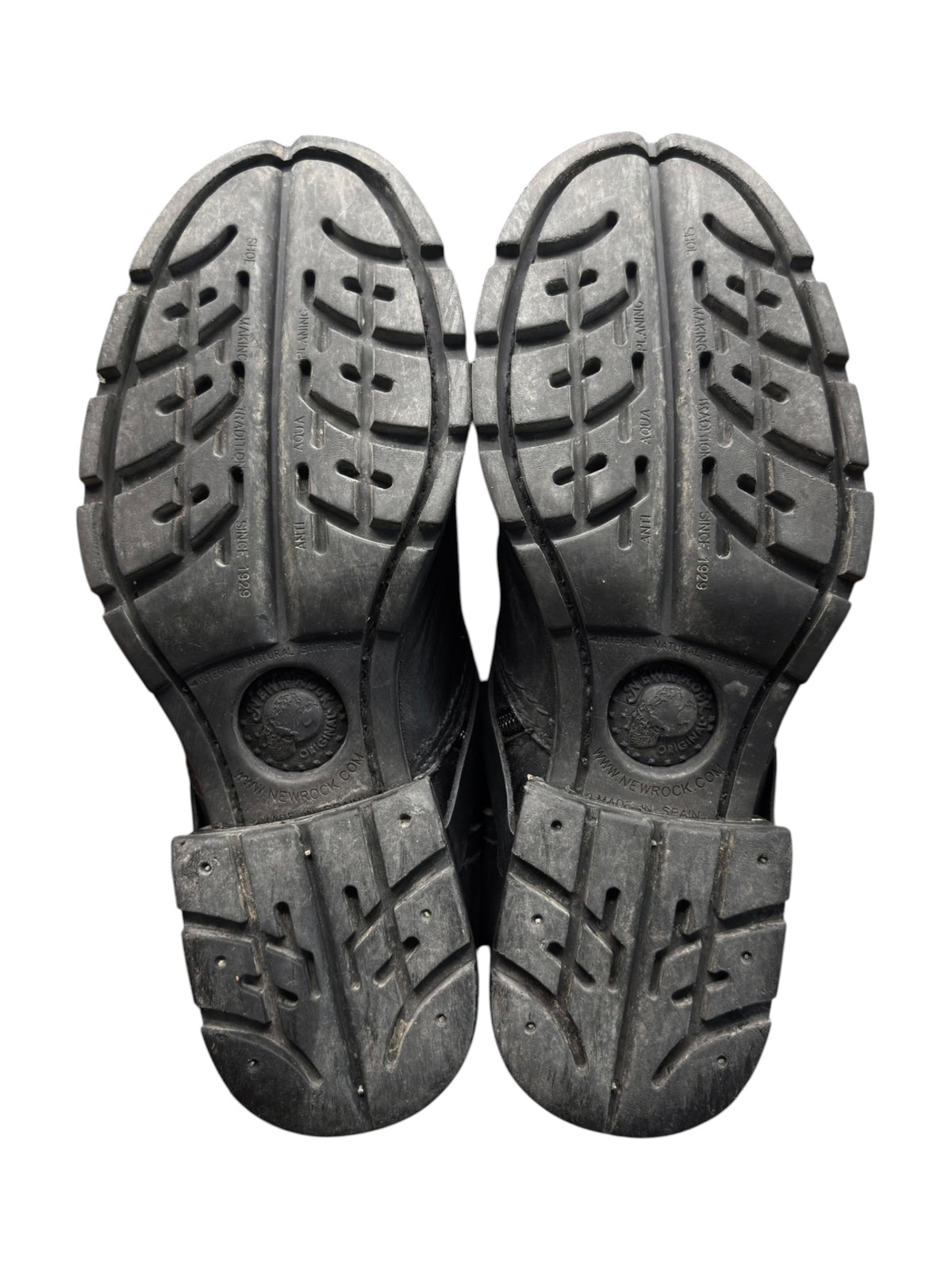 Leather biker boots outsole pair with chunky tread pattern and heel grip details