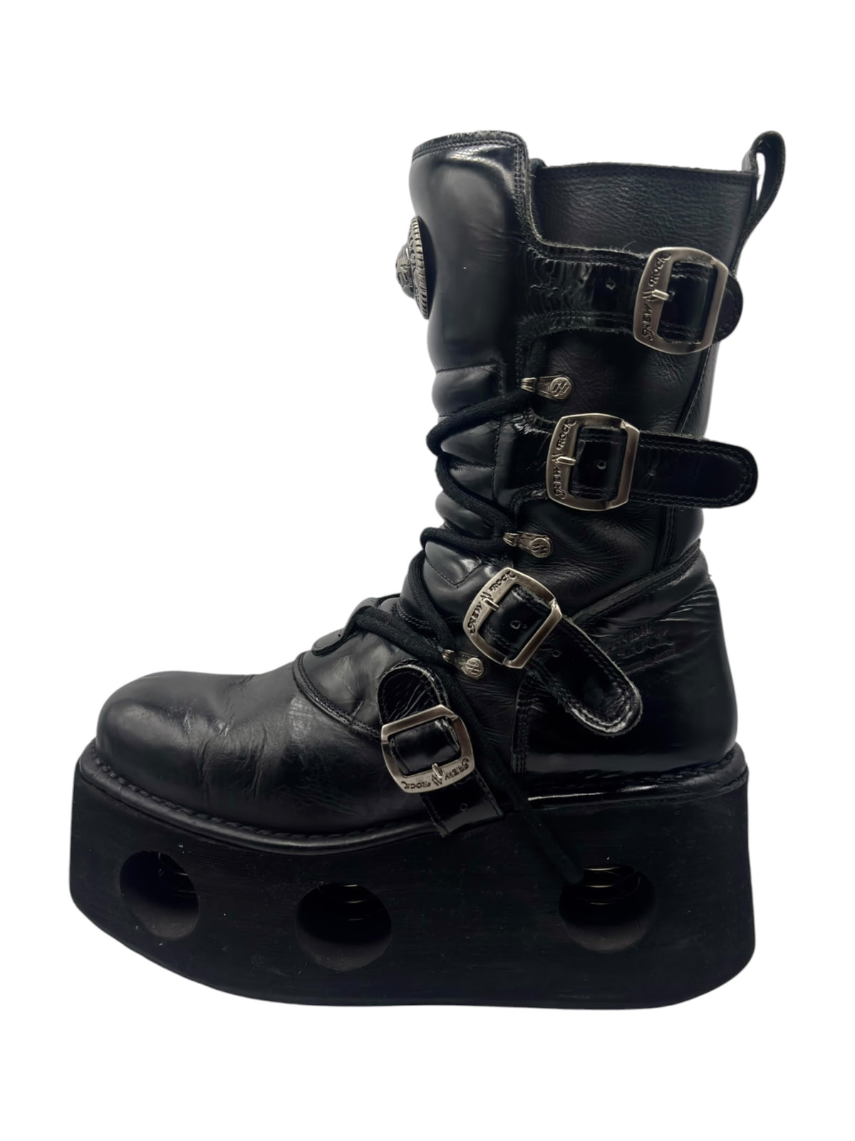 Black mid-calf platform boots with chunky dome tread and buckle straps
