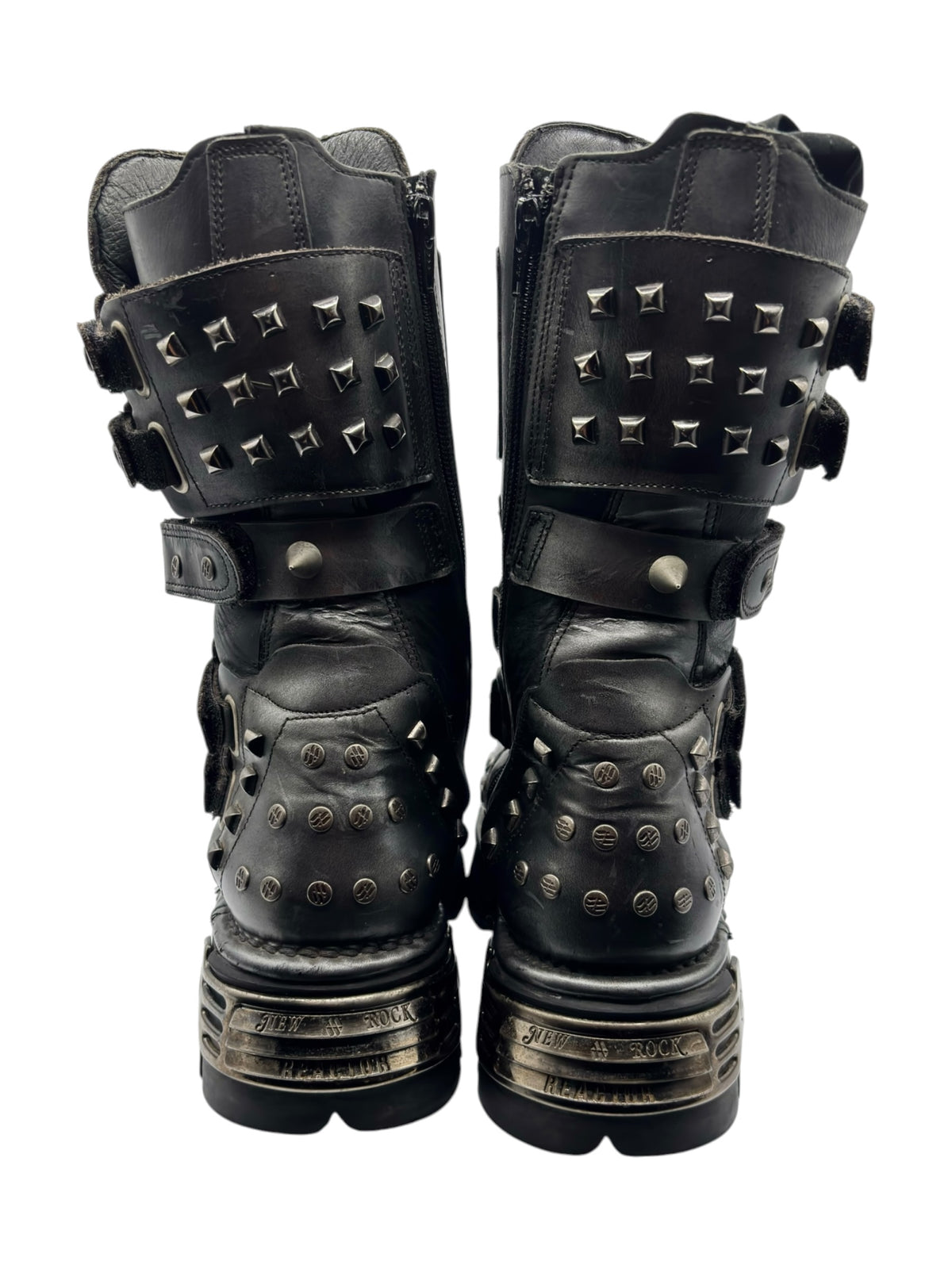Vintage studded chain boots back view showing stacked straps and metal stud accents